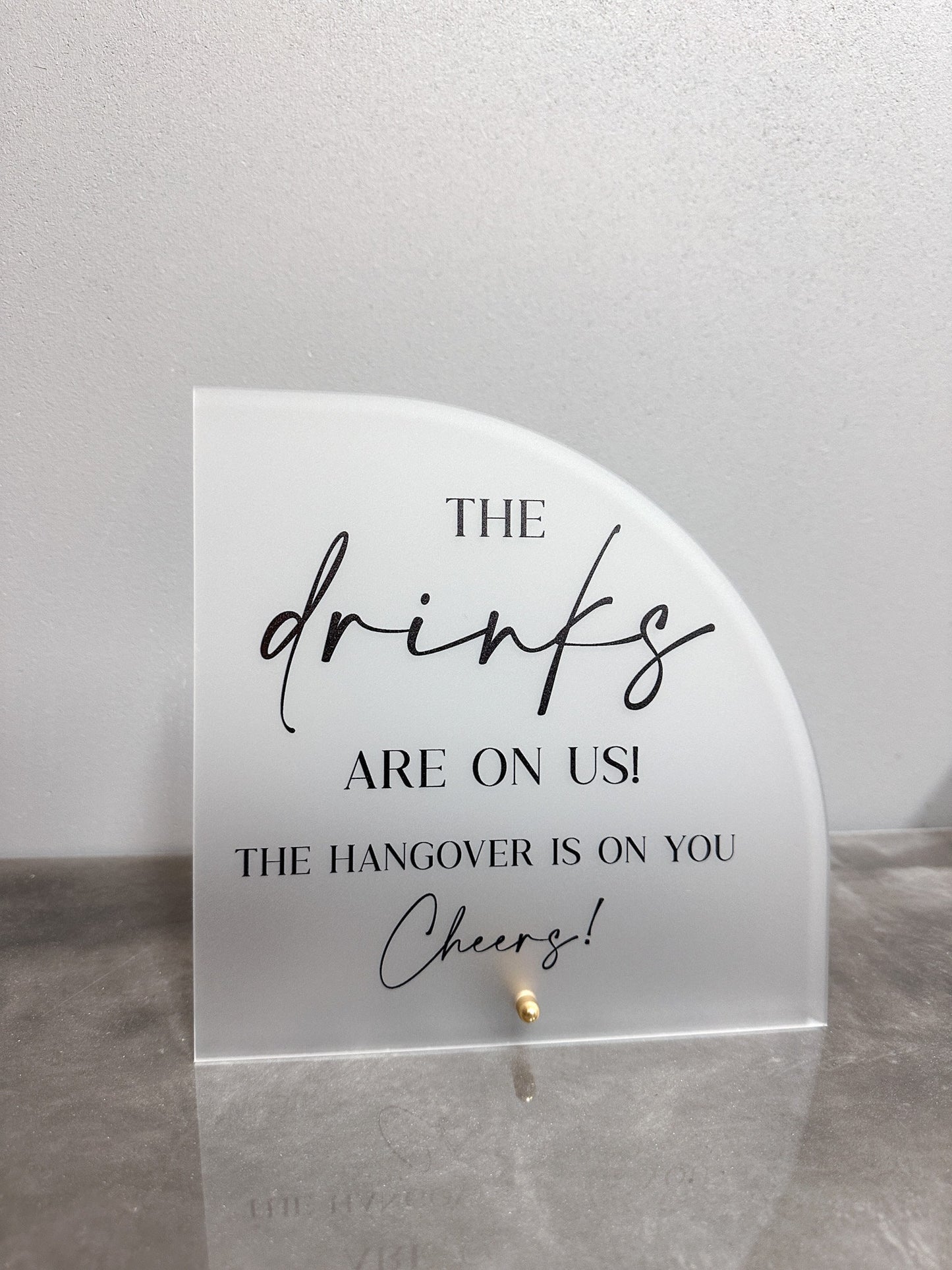 The Drinks Are On Us Sign