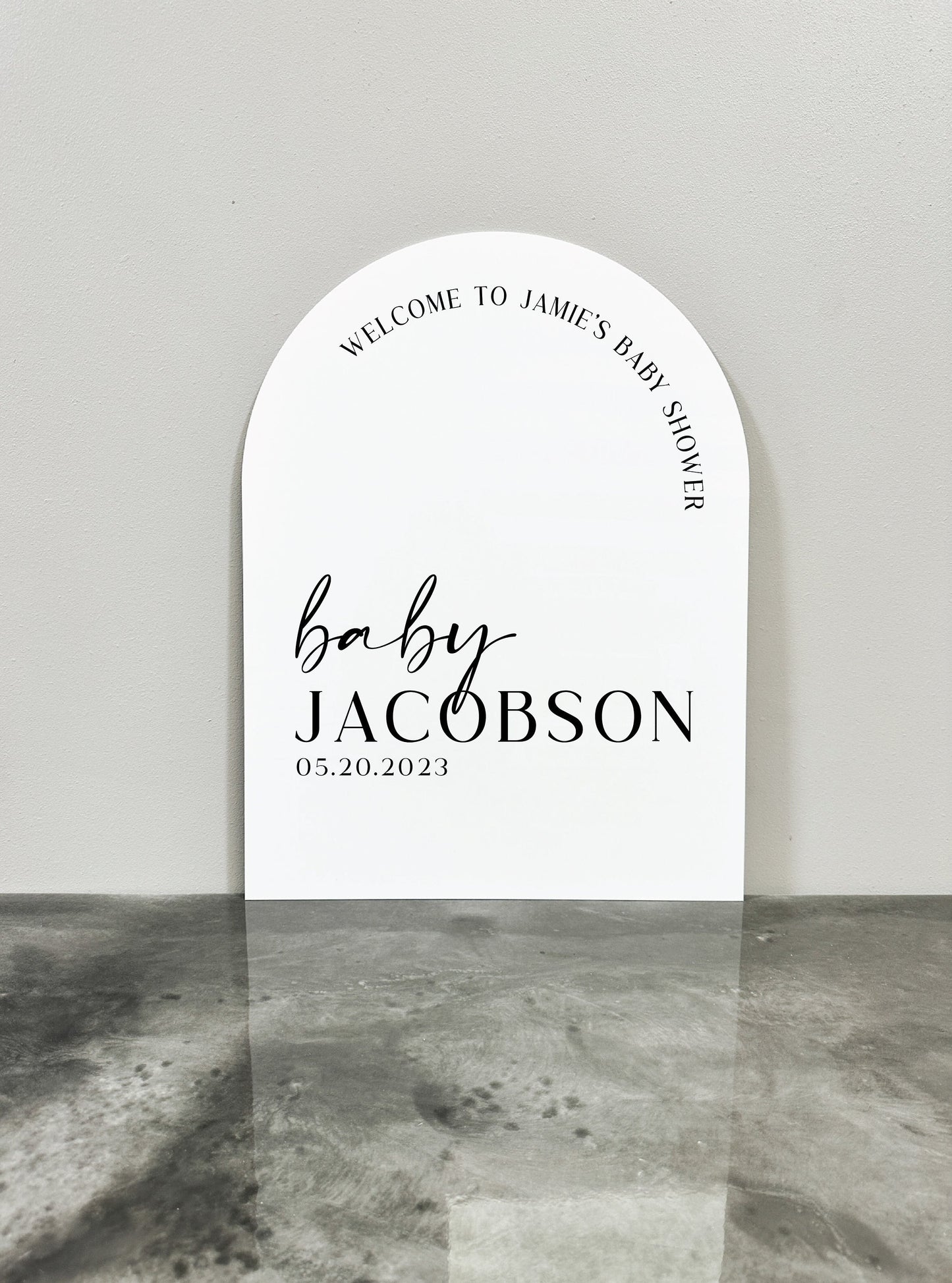 White Arch Acrylic Baby Shower signs that reads "WELCOME TO JAMIE'S BABY SHOWER baby JACOBSON 05.20.2023"