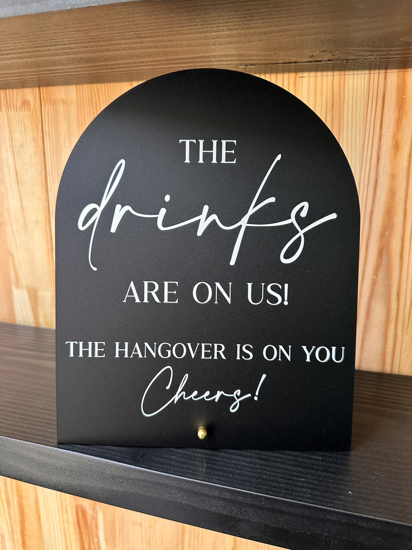 The Drinks Are On Us Sign