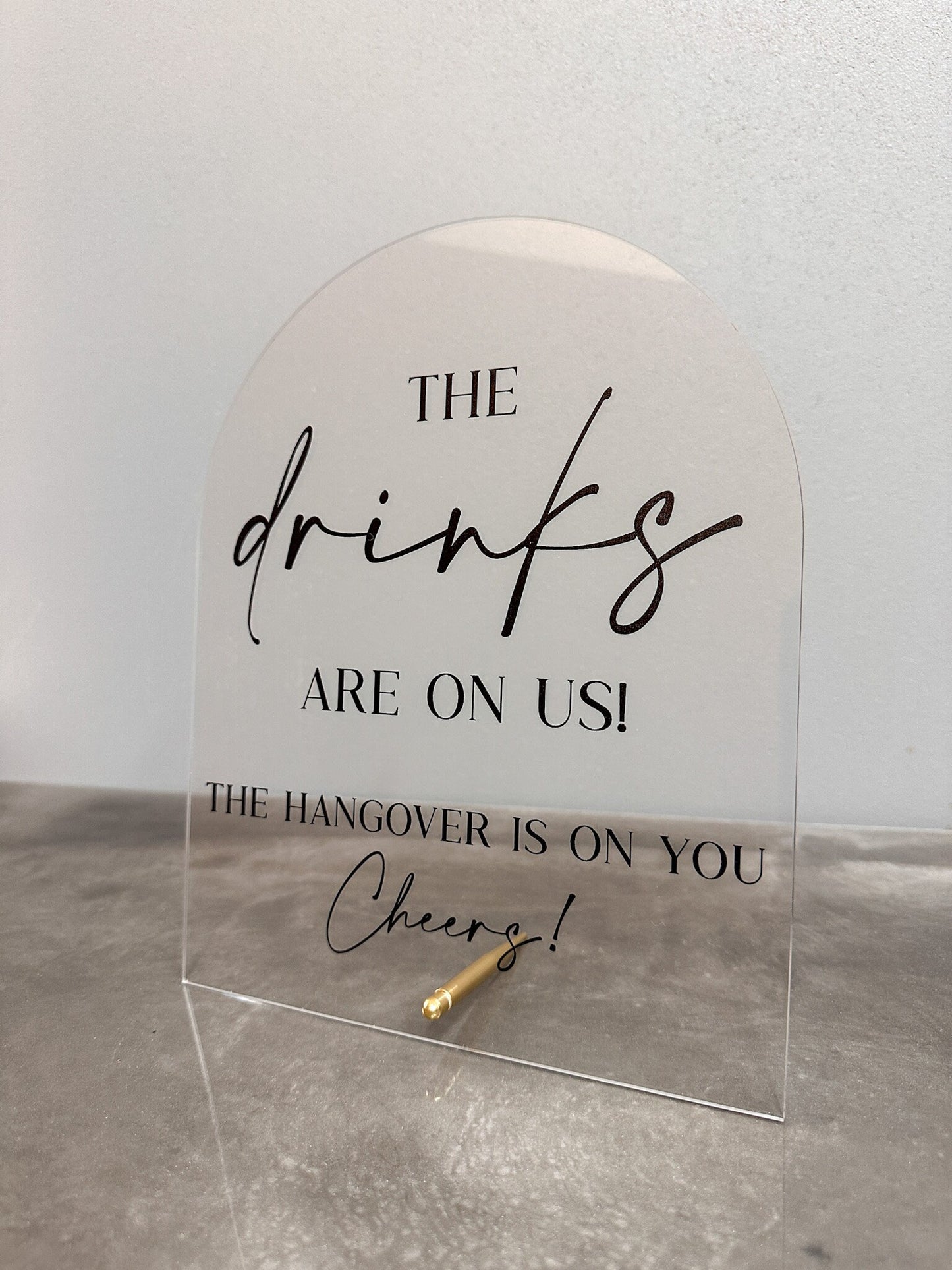 The Drinks Are On Us Sign